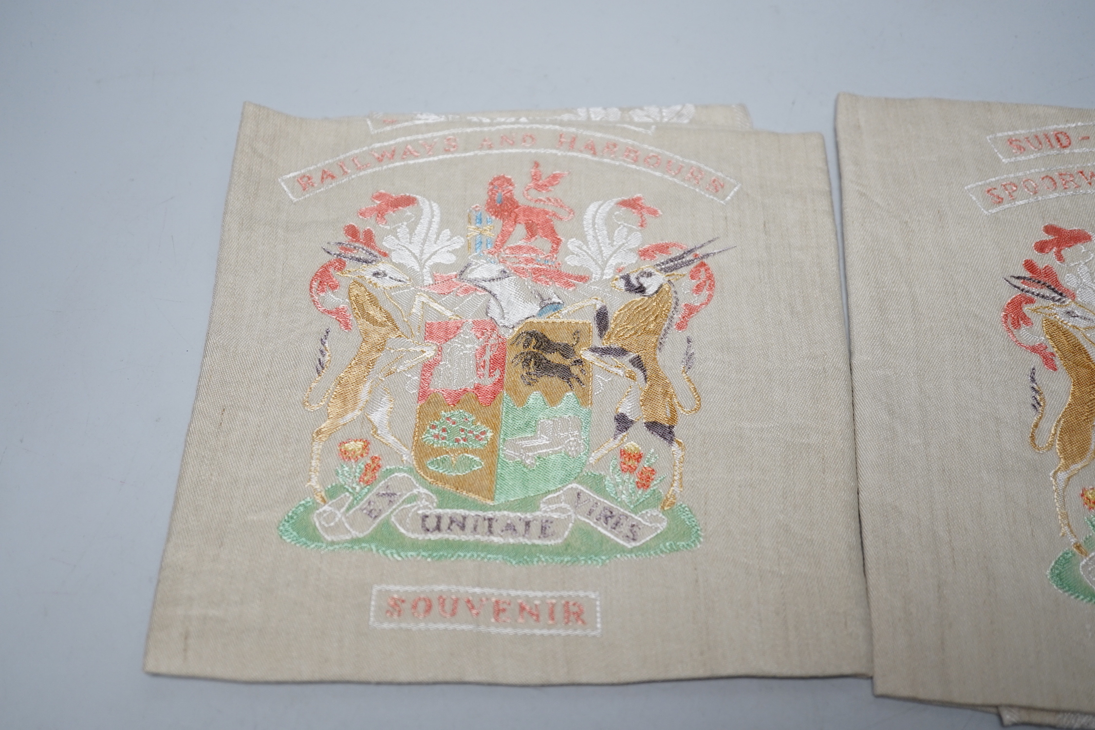 Two South African late 19th century damask railway napkins and a velvet rugby or cricketing cap